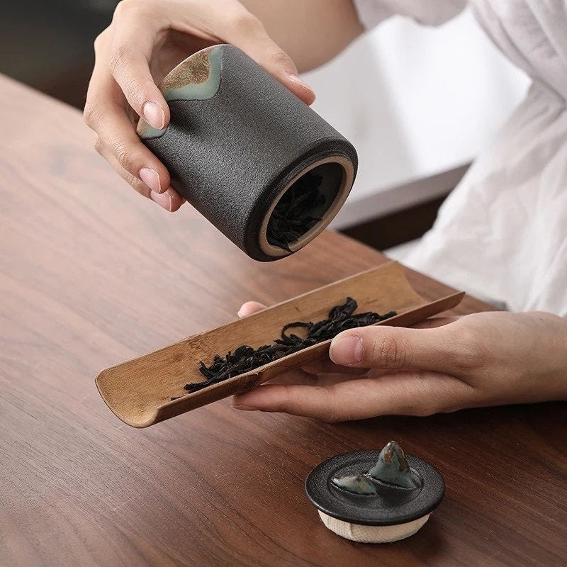 Black and white coffee canister acacuss